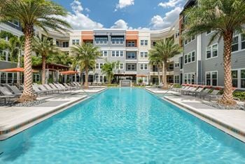 Resort-style pool with covered cabanas & heated spa